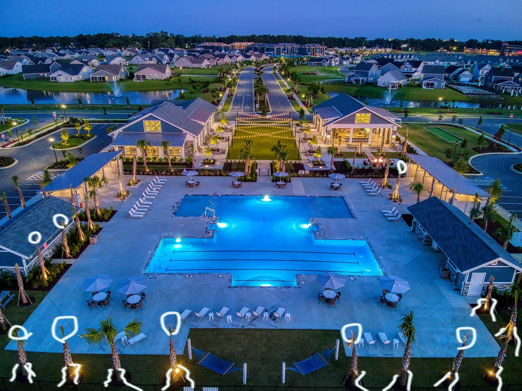 Nighttime resort pool before retouching